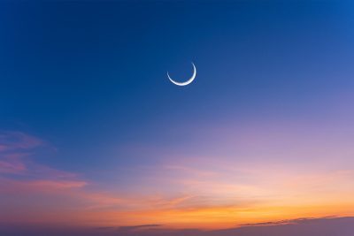 Ramadan islamic night sunset with eastern moon, Hilal and Eid clear sky at night with some clouds